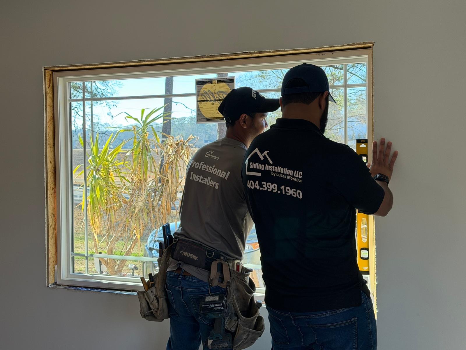 Siding Installation by Lucas team installing a window in Atlanta, GA